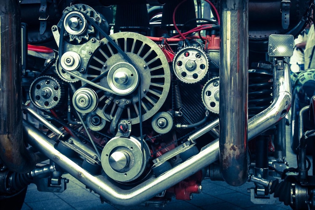 Image of an engine with interlocking gears, rotors and drive belts